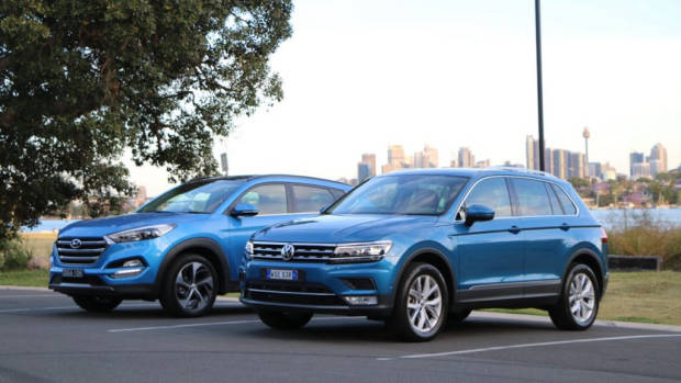 A Caribbean Blue Volkswagen Tiguan and Ara Blue Hyundai Tucson in Australia