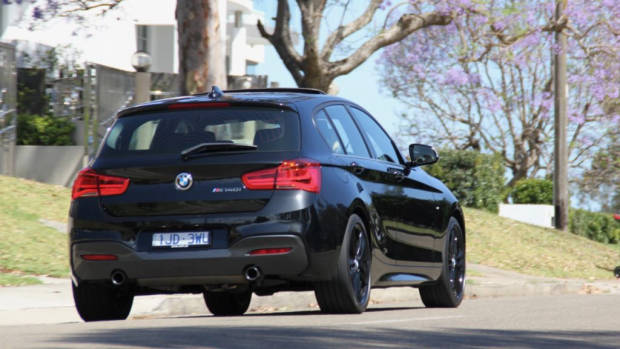 2018 BMW M140i Review Driving Rear End Black Sapphire