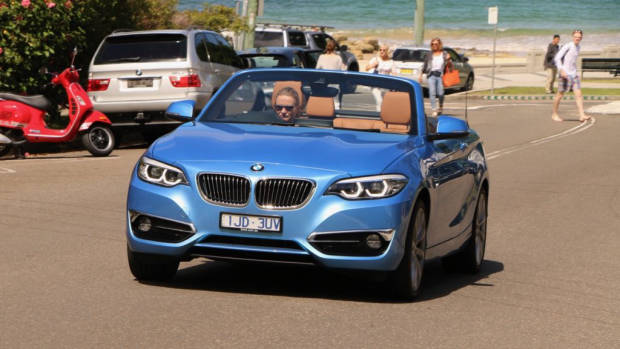 2018 BMW 230i Convertible Seaside Blue Driving