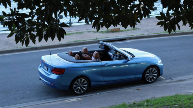 2018 BMW 230i Convertible Seaside Blue Driving