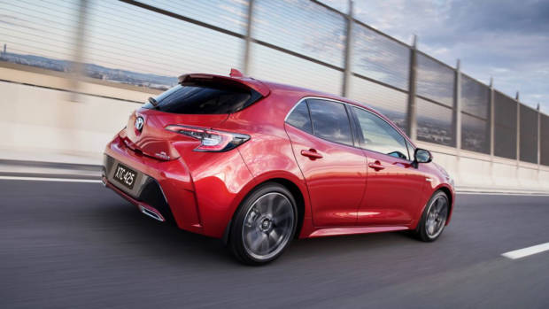 2019 Toyota Corolla ZR hybrid red rear 3/4 driving