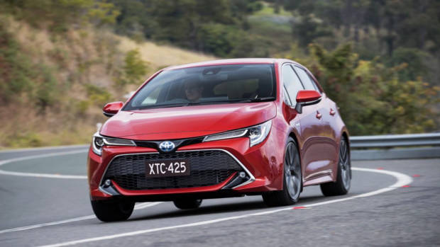 2019 Toyota Corolla ZR hybrid Volcanic Red front 3/4 cornering