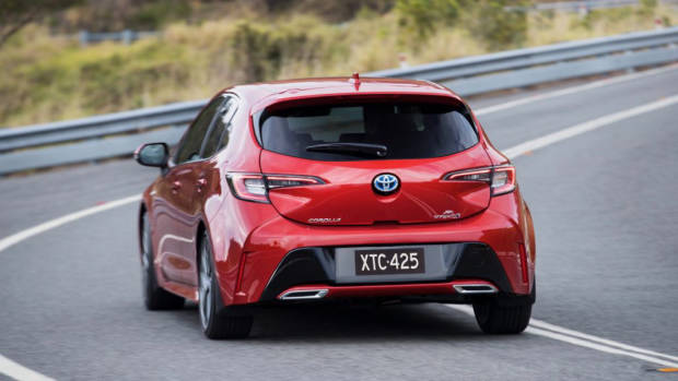 2019 Toyota Corolla ZR hybrid Volcanic Red rear 3/4 corner