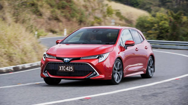 2019 Toyota Corolla ZR hybrid Volcanic Red side corner