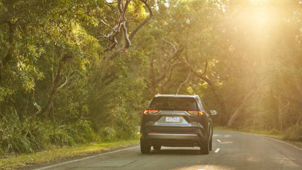 Grey Toyota RAV4 Cruiser Hybrid driving