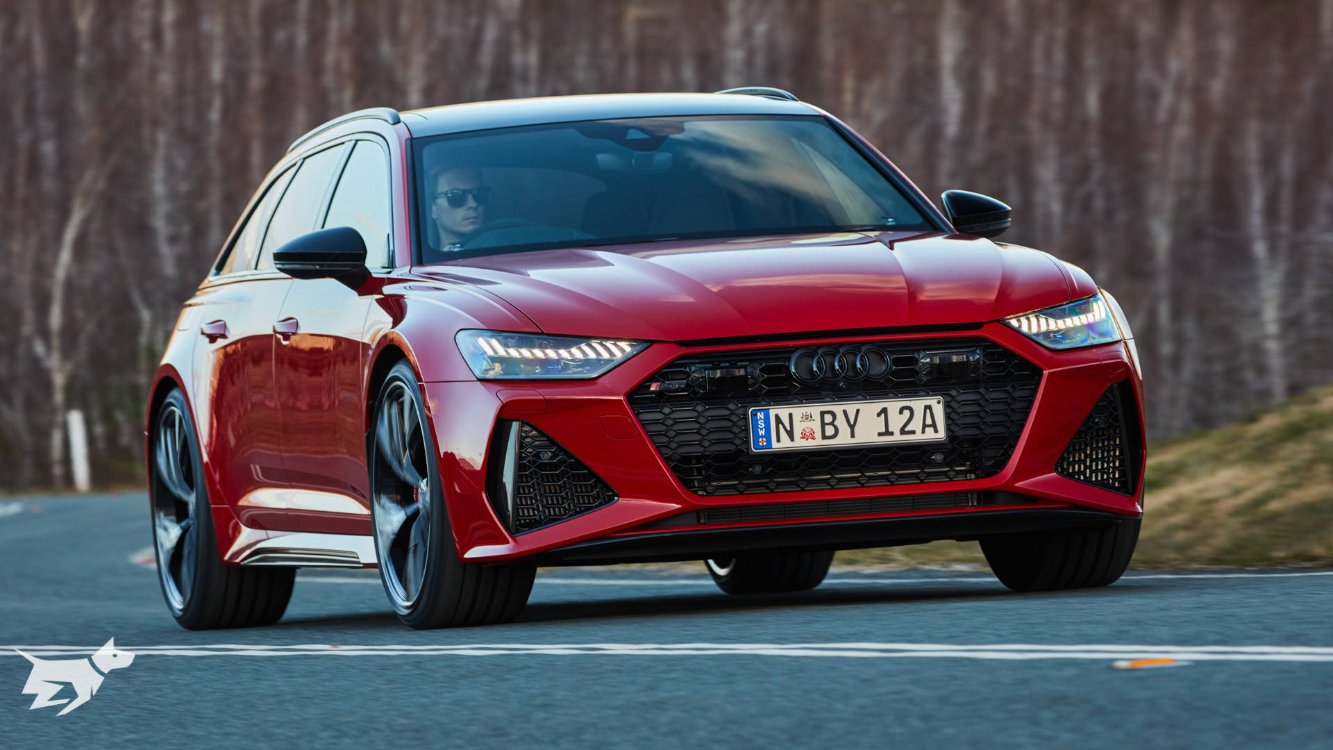 2020 Audi RS6 Avant in Tango Red driving on the road