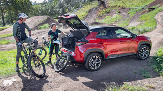 The 2021 Toyota Yaris Cross Urban hybrid AWD in red with a black roof