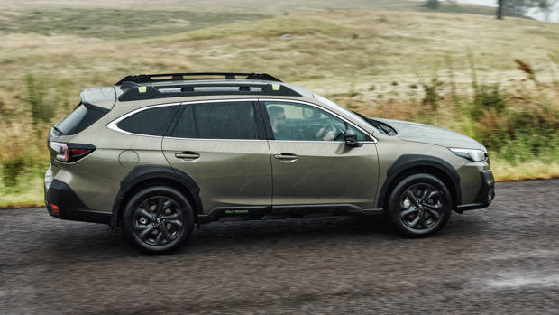 Subaru Outback 2021 green driving