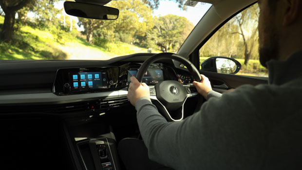 Volkswagen Golf base 2021 interior with person