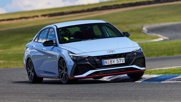 2021 Hyundai i30 Sedan N blue sedan exterior front 3/4 action shot Wakefield Park 1