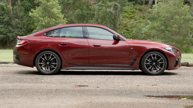 2022 BMW M440i sedan purple - static side-profile shot