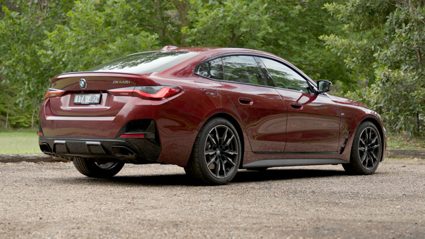 2022 BMW M440i sedan purple - static rear 3/4 shot