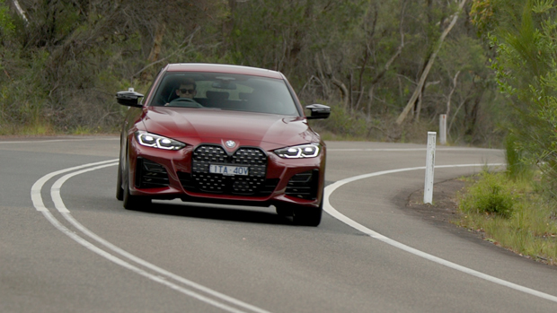 2022 BMW M440i sedan purple - dynamic front 3/4 shot