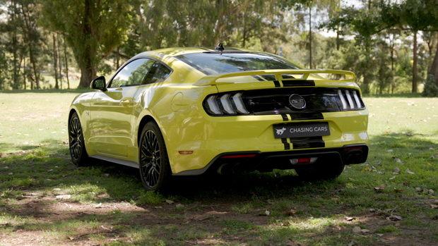 2022 Ford Mustang GT Fastback V8 coupe yellow - parked rear 3/4 shot