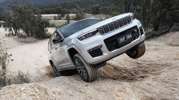 2022 Jeep Grand Cherokee Summit Reserve SUV silver - front 3/4 off-road shot #1