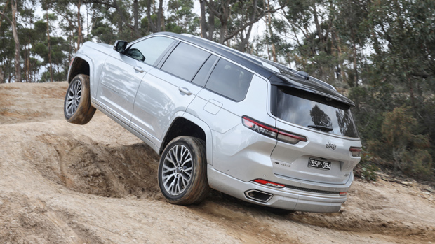 2022 Jeep Grand Cherokee Summit Reserve SUV silver - rear 3/4 off-roading shot #1