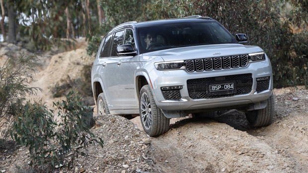 2022 Jeep Grand Cherokee Summit Reserve SUV silver - front 3/4 off-roading shot #2