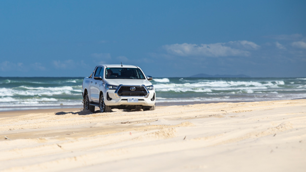 2022 Toyota Hilux SR5 review white ute - dynamic front 3/4 beach pic #2