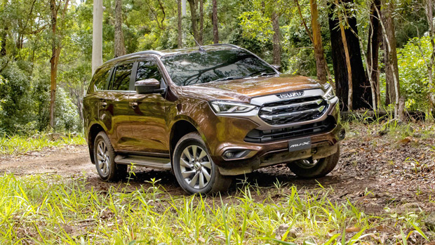 2021 Isuzu MU-X LS-U - front 3/4 dynamic shot, driving on grass
