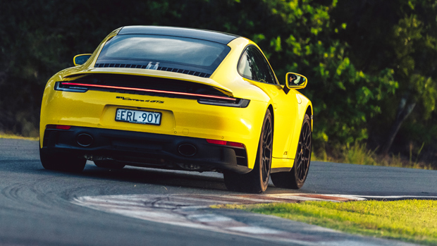 2022-Porsche-911-GTS-coupe-yellow---dynamic-rear-3-4-shot-on-track