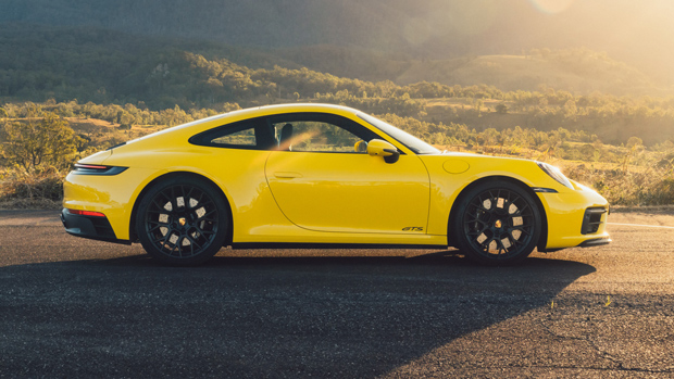 2022-Porsche-911-GTS-coupe-yellow---side-profile-static-shot
