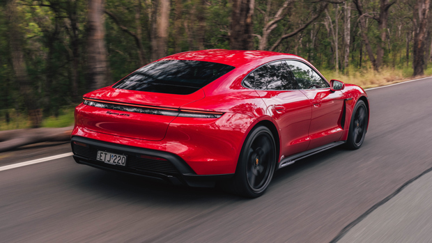 2022 Porsche Taycan GTS sedan crimson - dynamic rear 3/4 shot