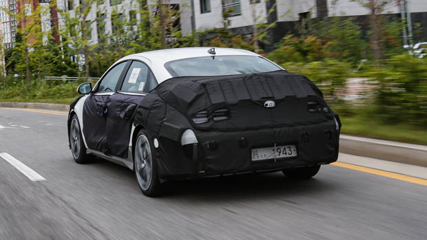 Hyundai Ioniq 6 prototype driving rear