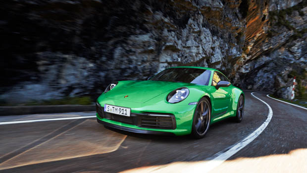 Porsche 911 Carrera T 2023 driving 3/4 mountain pass