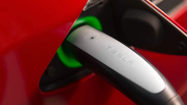 Tesla charging cable plugged in