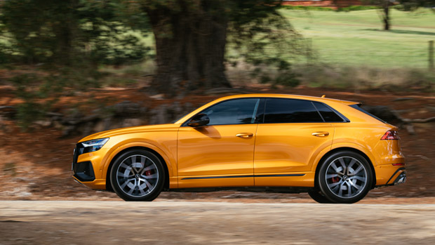 Audi SQ8 2023 dragon orange side profile driving