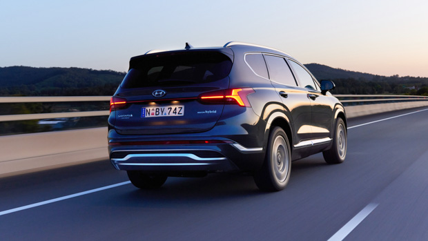 Hyundai Santa Fe Hybrid Highlander 2023 rear 3/4 highway