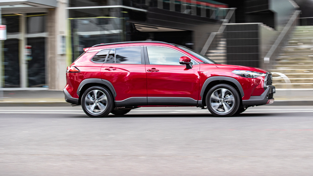 2023 Toyota Corolla Atmos Hybrid AWD wagon red exterior front 3/4 action shot #2