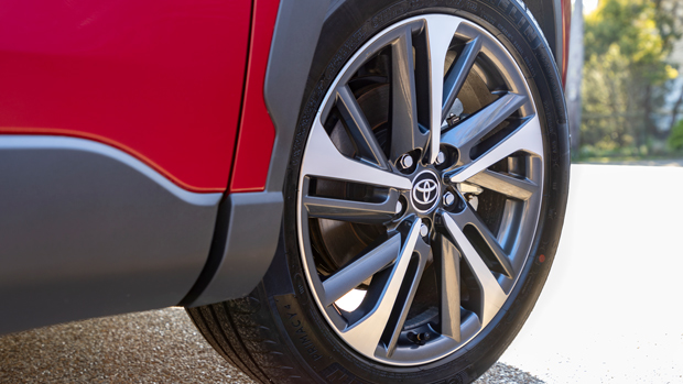 2023 Toyota Corolla Atmos Hybrid AWD wagon red exterior front wheel