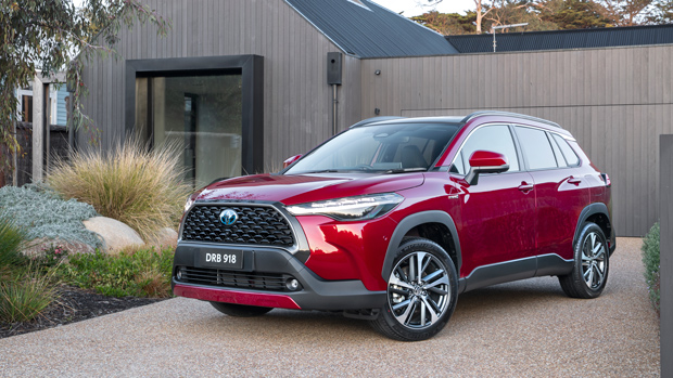 2023 Toyota Corolla Atmos Hybrid AWD wagon red exterior static front 3/4