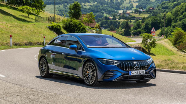 2023 Mercedes-Benz EQE driving blue on the road