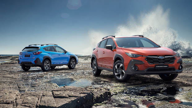 2023 Subaru Crosstrek blue and red duo with water splash