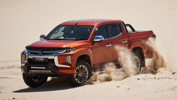 Mitsubishi Triton front 3/4 sand driving