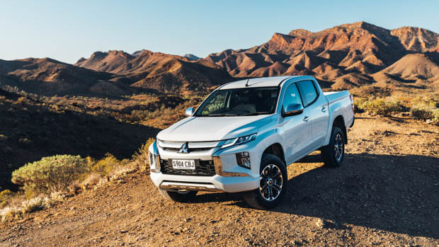 Mitsubishi Triton front 3/4 static mountain background