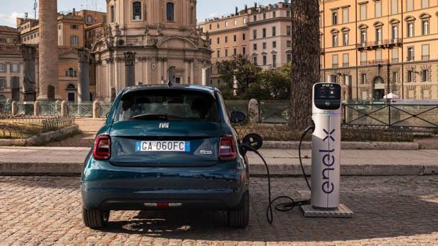 2022 Fiat 500e La Prima charging at classic location