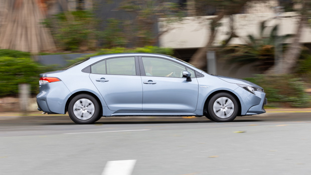 Toyota Corolla Ascent Sport Hybrid side driving 2