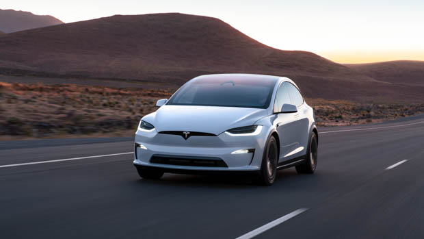 Tesla Model X Plaid driving on road