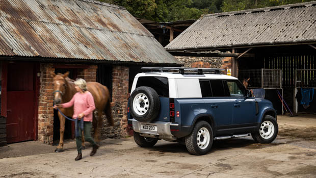 2023 Land Rover Defender 110 Hard Top rear 3/4 with horse