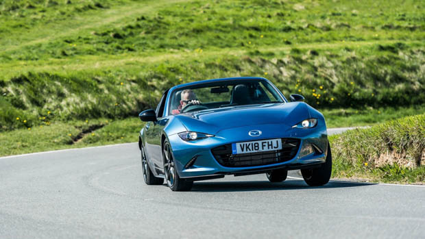Mazda MX-5 blue on the road cornering