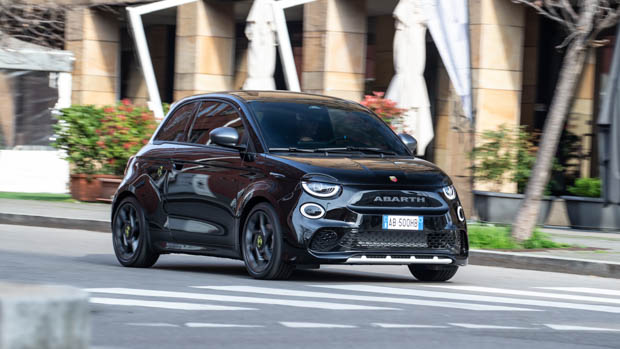 2023 Abarth 500e black driving on road
