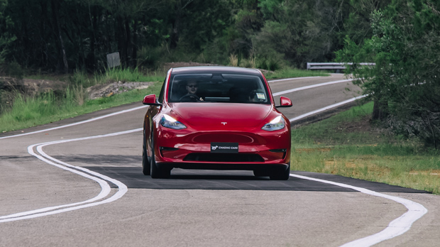 2023 Tesla Model Y Performance red front flat driving