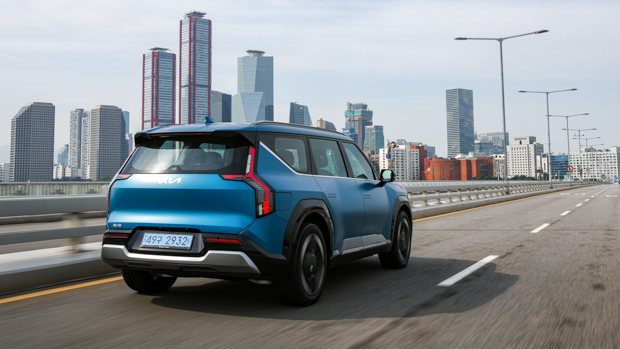 Kia EV9 GT-Line 2024 driving rear background