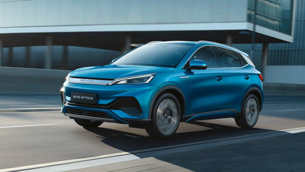 BYD Atto 3 blue front 3/4 driving shot blur