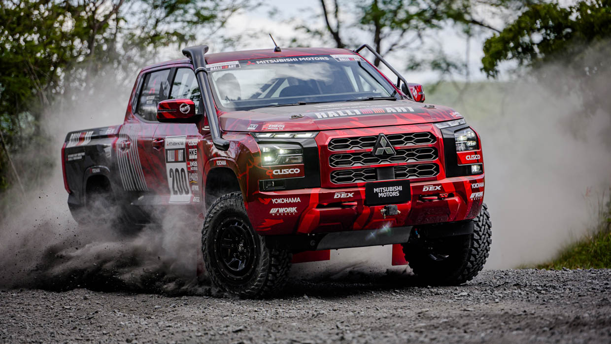 2024 Mitsubishi Triton AXCR rally ute front 3/4 4 dust