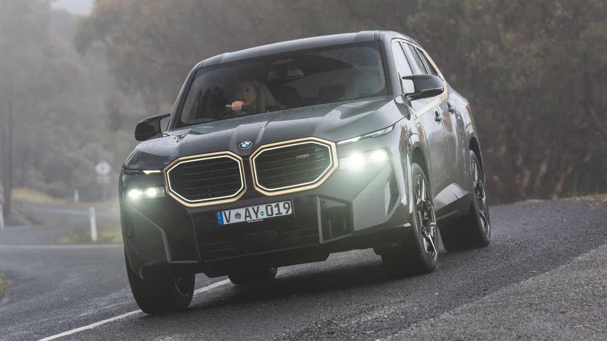 BMW XM 2023 driving front 3/4