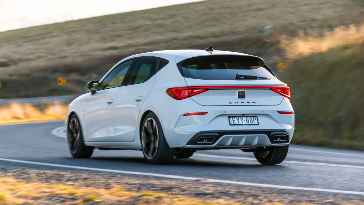 Cupra Leon V 2023 driving rear 3/4